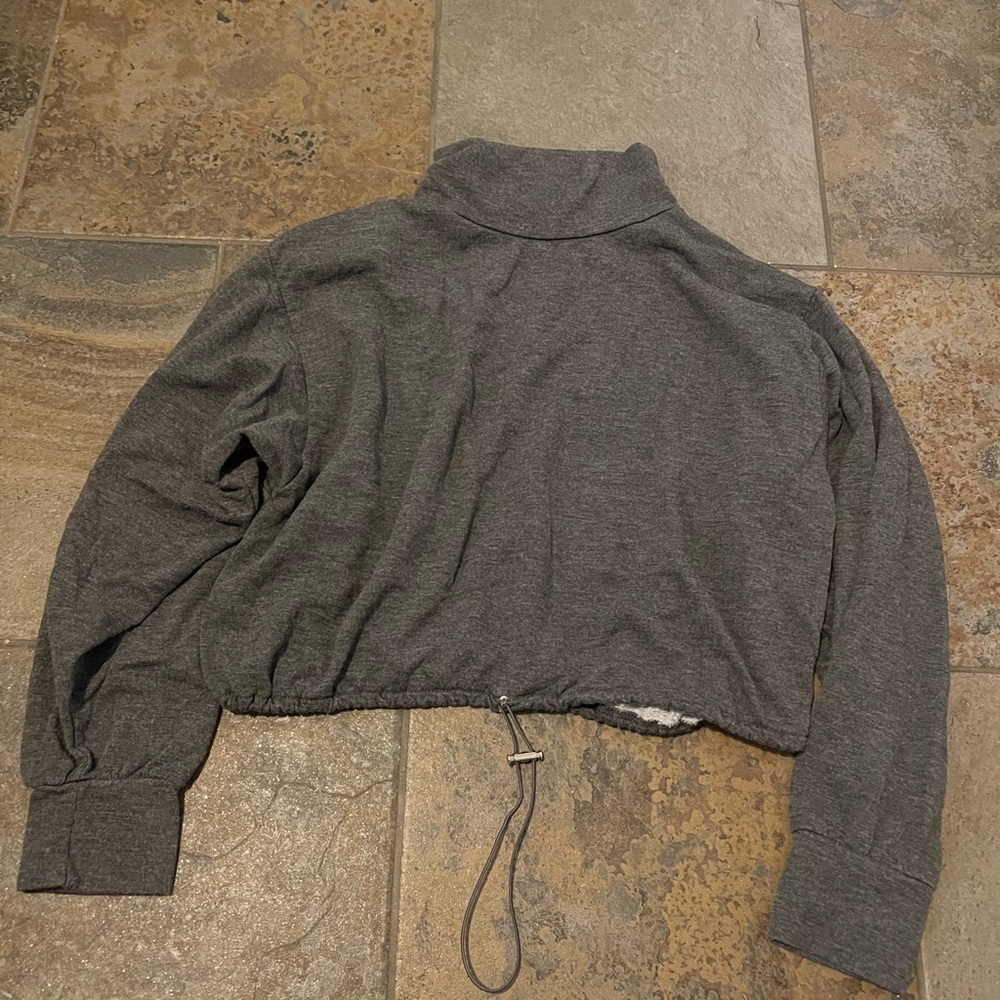 Crop grey sweater size medium. Adjustable. Very comfortable